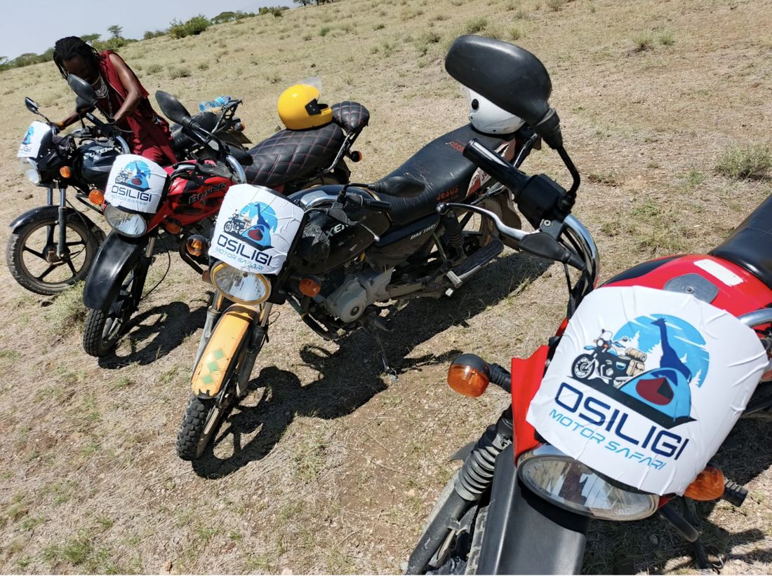 Motorbikes branded with the Osiligi Motor Safari logo, ready to ride
